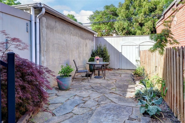 view of patio featuring outdoor dining area and a fenced backyard
