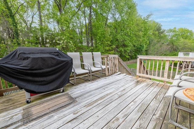 wooden deck featuring grilling area