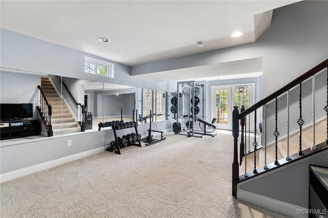 workout room with baseboards, recessed lighting, a wealth of natural light, and carpet flooring