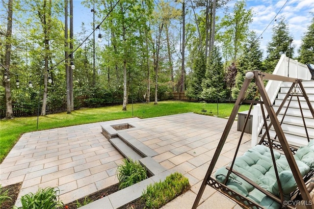 view of patio featuring a fire pit and a fenced backyard