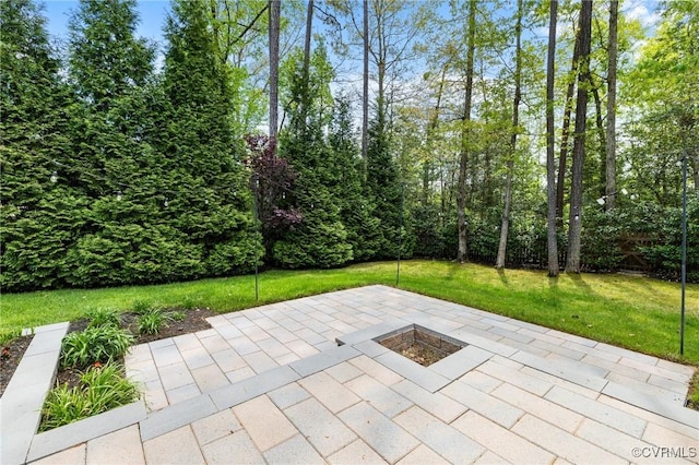 view of patio with an outdoor fire pit