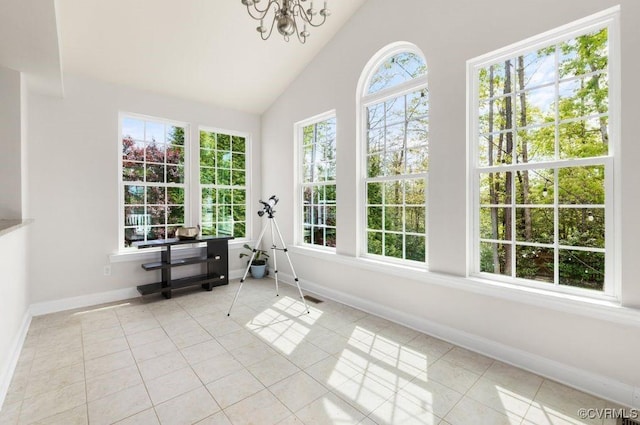 sunroom / solarium featuring an inviting chandelier and visible vents