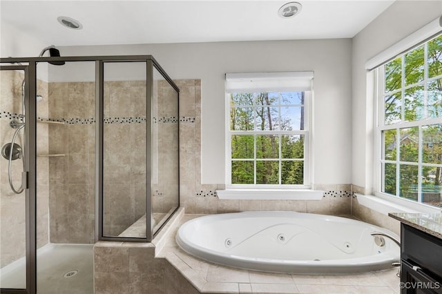 bathroom featuring a stall shower and a healthy amount of sunlight