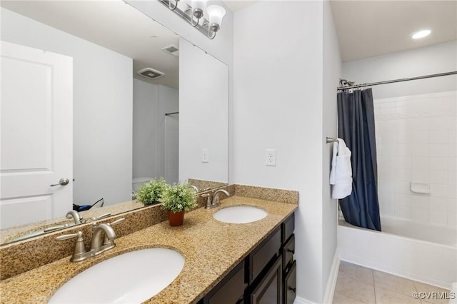 full bathroom featuring baseboards, shower / tub combo, tile patterned flooring, and a sink