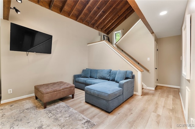 living room with stairway, wooden ceiling, baseboards, and wood finished floors