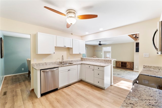 kitchen with light wood-style floors, a sink, a ceiling fan, and dishwasher