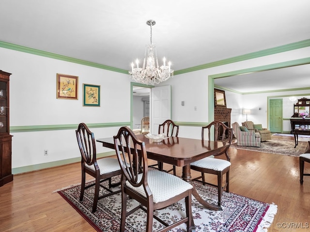 1735 Old Powhatan Ests, Powhatan, VA 23139 - dining room with a chandelier, light wood finished floors, and ornamental molding