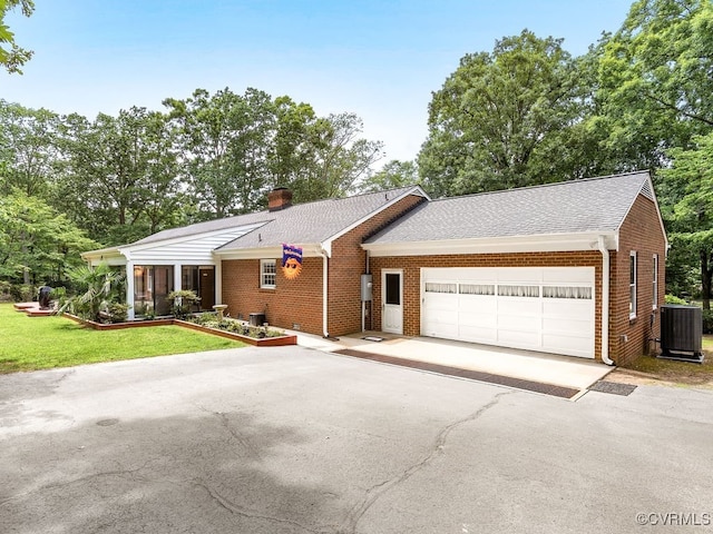 1735 Old Powhatan Ests, Powhatan, VA 23139 - ranch-style house with brick siding, a garage, concrete driveway, a chimney, and a front lawn