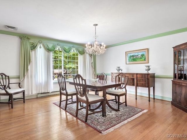 1735 Old Powhatan Ests, Powhatan, VA 23139 - dining space with a chandelier, light wood-style floors, crown molding, and a baseboard heating unit