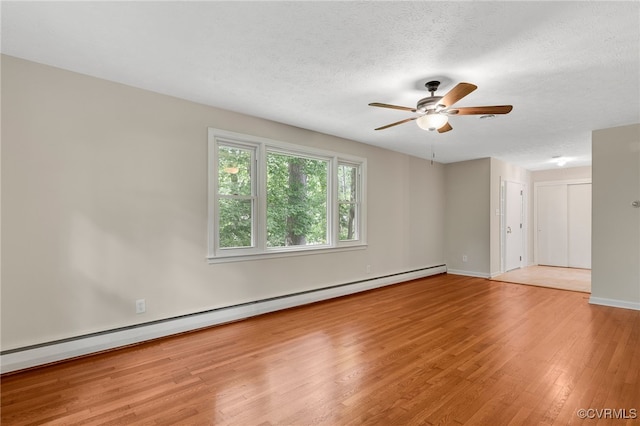 13101 Harrowgate Rd, Chester, VA 23831 - empty room with a baseboard radiator, light wood-style floors, ceiling fan, a textured ceiling, and baseboards