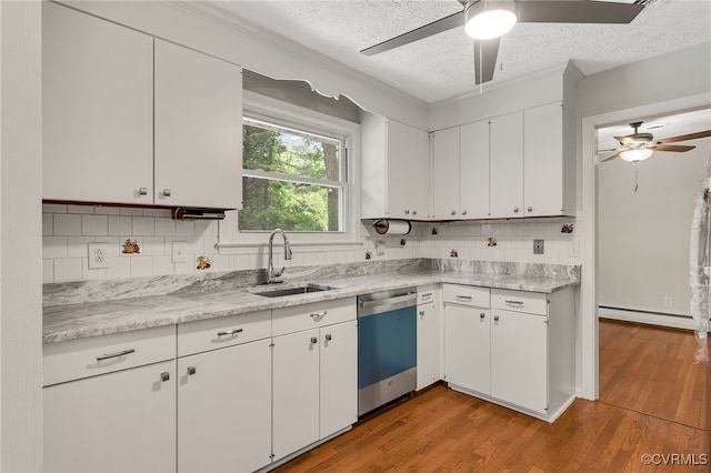 13101 Harrowgate Rd, Chester, VA 23831 - kitchen featuring dishwasher, a sink, ceiling fan, a baseboard heating unit, and a textured ceiling