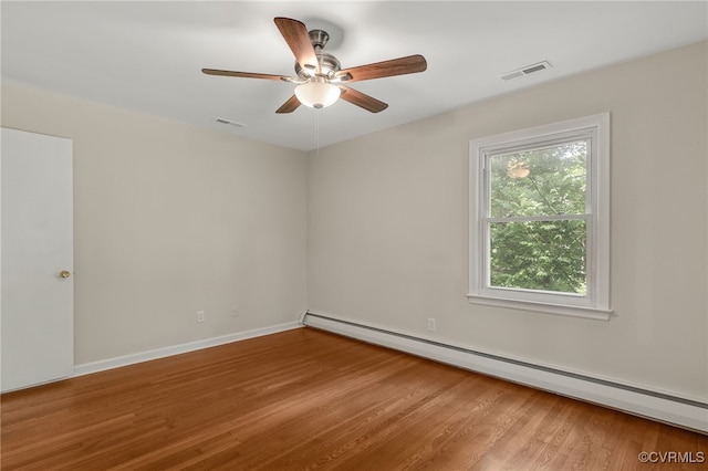 13101 Harrowgate Rd, Chester, VA 23831 - unfurnished room featuring a baseboard radiator, wood finished floors, ceiling fan, and baseboards