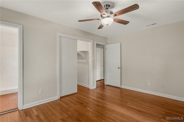 13101 Harrowgate Rd, Chester, VA 23831 - unfurnished bedroom with wood finished floors, baseboards, and ceiling fan