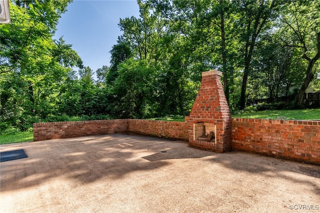 13101 Harrowgate Rd, Chester, VA 23831 - view of patio / terrace featuring an outdoor brick fireplace