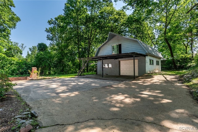13101 Harrowgate Rd, Chester, VA 23831 - view of home's exterior featuring a gambrel roof and asphalt driveway