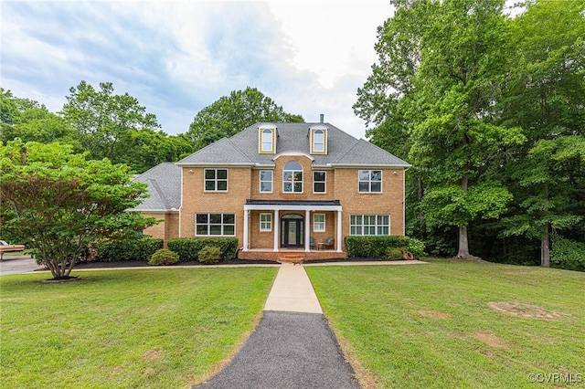9073 Pine Hill Rd, Mechanicsville, VA 23116 - view of front facade featuring a front yard and brick siding