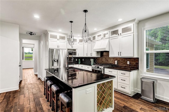 9073 Pine Hill Rd, Mechanicsville, VA 23116 - kitchen featuring stainless steel appliances, premium range hood, dark wood finished floors, tasteful backsplash, and recessed lighting