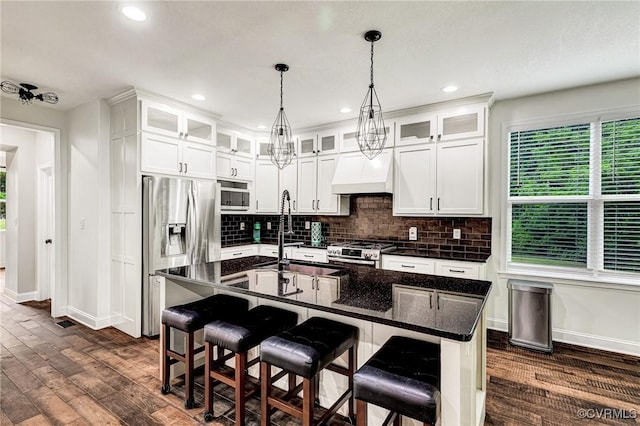 9073 Pine Hill Rd, Mechanicsville, VA 23116 - kitchen with stainless steel appliances, custom range hood, dark wood finished floors, decorative backsplash, and decorative light fixtures