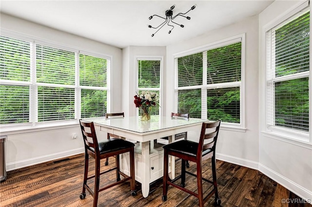 9073 Pine Hill Rd, Mechanicsville, VA 23116 - dining space with dark wood-style floors and baseboards