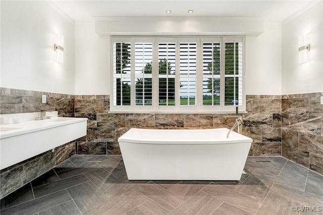 9073 Pine Hill Rd, Mechanicsville, VA 23116 - full bathroom featuring ornamental molding, a freestanding tub, tile walls, a wainscoted wall, and tile patterned flooring