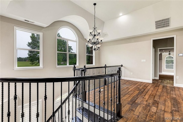 9073 Pine Hill Rd, Mechanicsville, VA 23116 - hallway featuring an upstairs landing, a chandelier, dark wood finished floors, and lofted ceiling