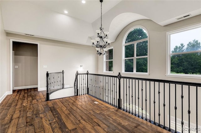 9073 Pine Hill Rd, Mechanicsville, VA 23116 - empty room featuring a chandelier, wood finished floors, vaulted ceiling, and recessed lighting