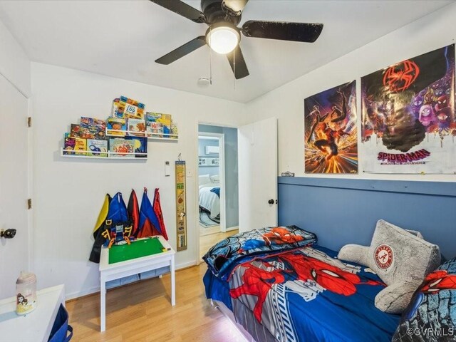 bedroom featuring ceiling fan and wood finished floors