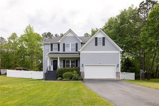 view of front facade featuring stairway, fence, aphalt driveway, a front lawn, and an attached garage