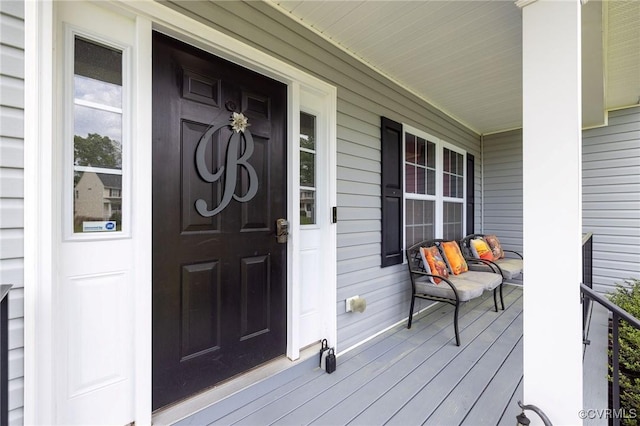 entrance to property featuring covered porch