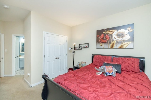 bedroom featuring a closet, carpet flooring, and baseboards