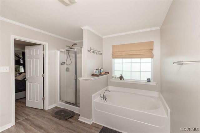bathroom with wood finished floors, visible vents, crown molding, and a stall shower