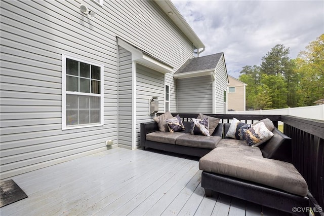 wooden terrace with outdoor lounge area
