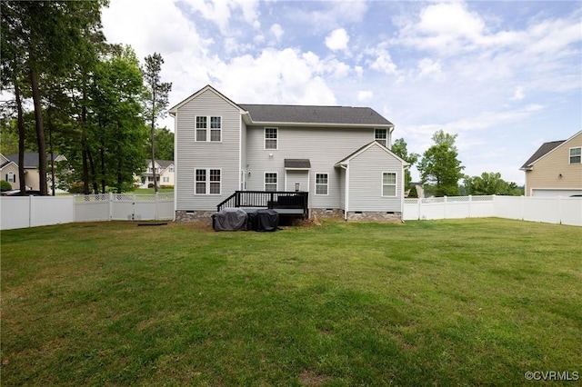 back of house featuring a lawn, a fenced backyard, a wooden deck, and crawl space