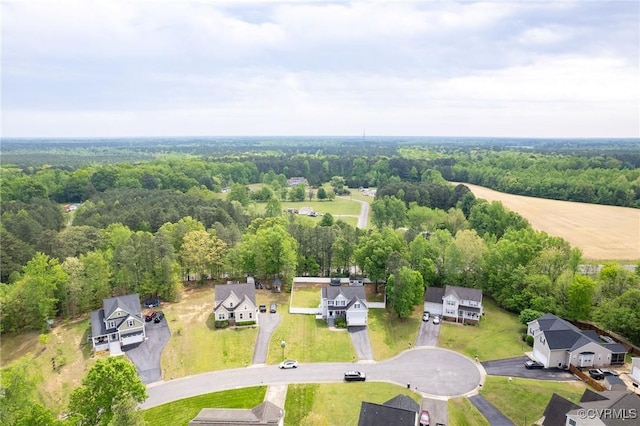 bird's eye view featuring a residential view and a view of trees