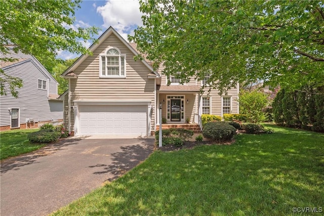 view of front of house featuring a garage, driveway, and a front yard