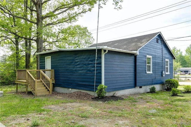 view of side of home featuring a deck and crawl space