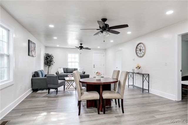 dining space with a ceiling fan, baseboards, recessed lighting, and light wood-type flooring