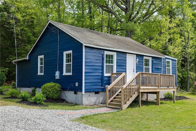 view of front of house with crawl space and a front yard