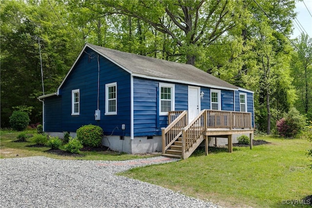 manufactured / mobile home featuring a front lawn, crawl space, and a deck
