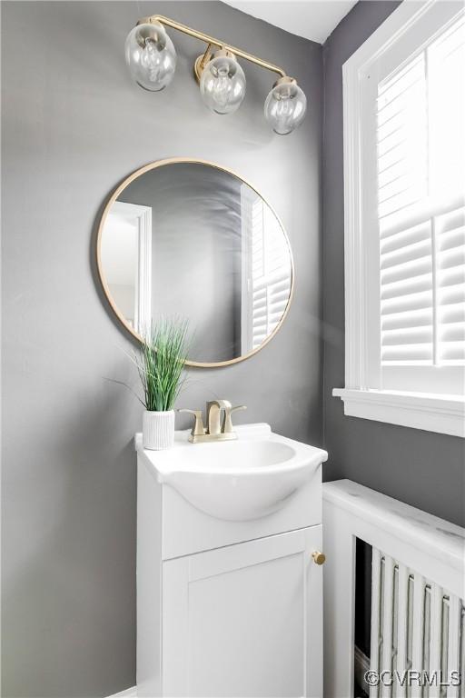 bathroom featuring a healthy amount of sunlight and vanity