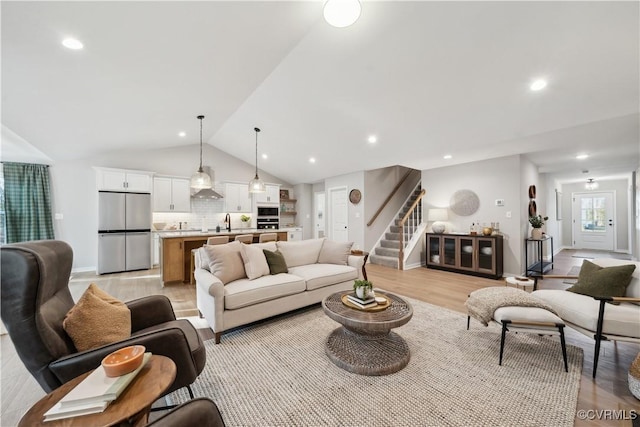 LOT12 Red Oak Cir Lot 12, Aylett, VA 23009 - living area featuring recessed lighting, stairs, light wood-style flooring, vaulted ceiling, and baseboards