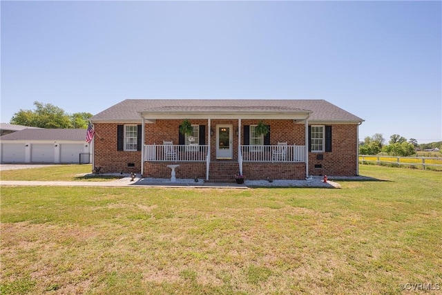 ranch-style house featuring a front lawn, a porch, brick siding, and a garage
