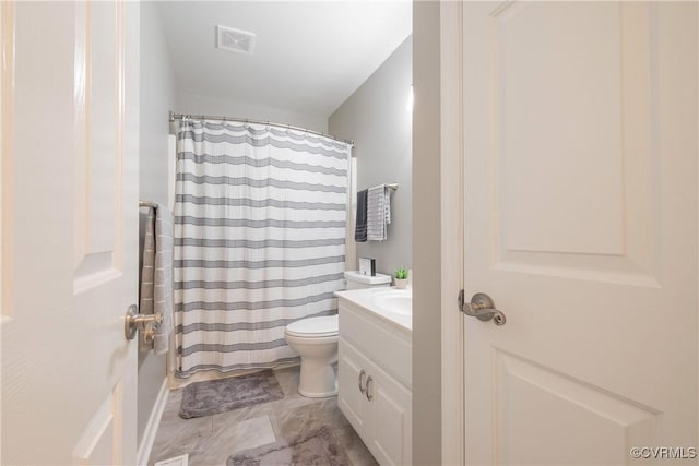 bathroom featuring visible vents, a shower with shower curtain, toilet, and vanity