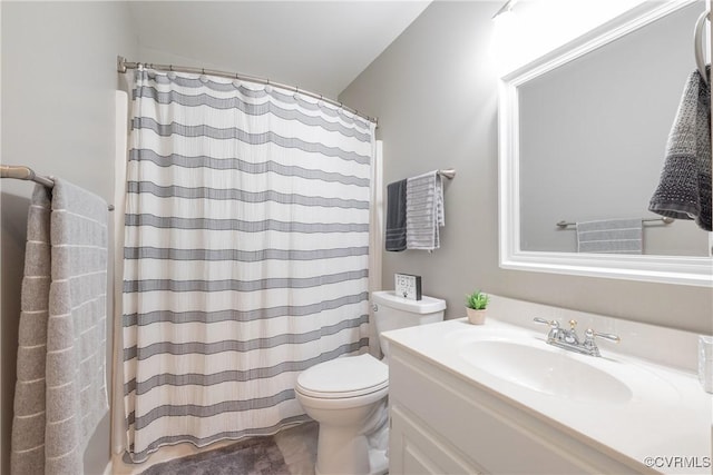 bathroom with a shower with shower curtain, toilet, and vanity