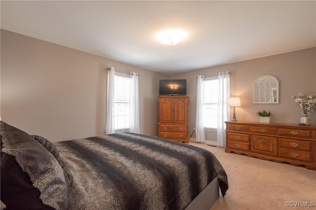 bedroom with light colored carpet