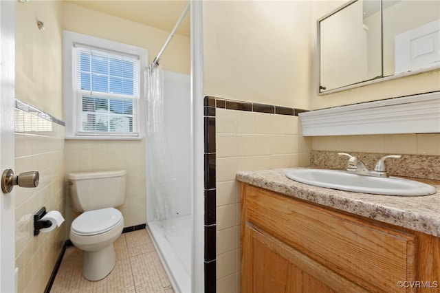 149 Courthouse Ln, Bowling Green, VA 22427 - bathroom with tile walls, toilet, a shower with curtain, vanity, and a wainscoted wall
