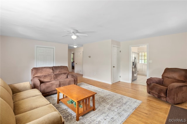 149 Courthouse Ln, Bowling Green, VA 22427 - living room featuring a ceiling fan, light wood-style flooring, and baseboards