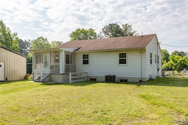 149 Courthouse Ln, Bowling Green, VA 22427 - view of front of home with a sunroom, a front yard, central AC, and a shingled roof