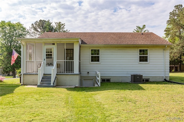 149 Courthouse Ln, Bowling Green, VA 22427 - rear view of property featuring central AC, a yard, roof with shingles, and a sunroom