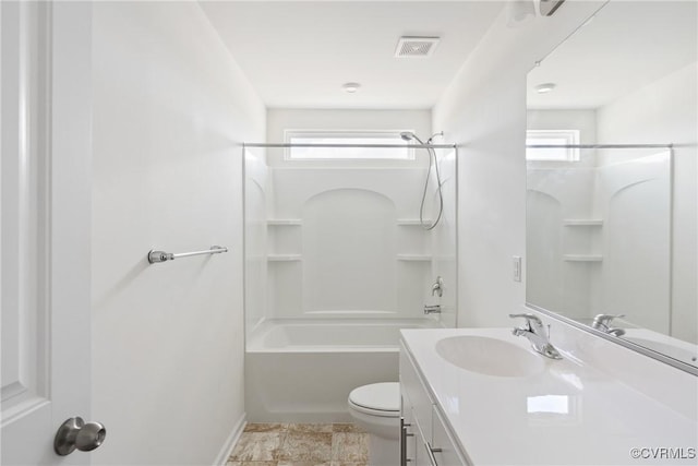 bathroom with visible vents, vanity, toilet, baseboards, and shower / tub combination
